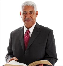 Man holding a book while smiling